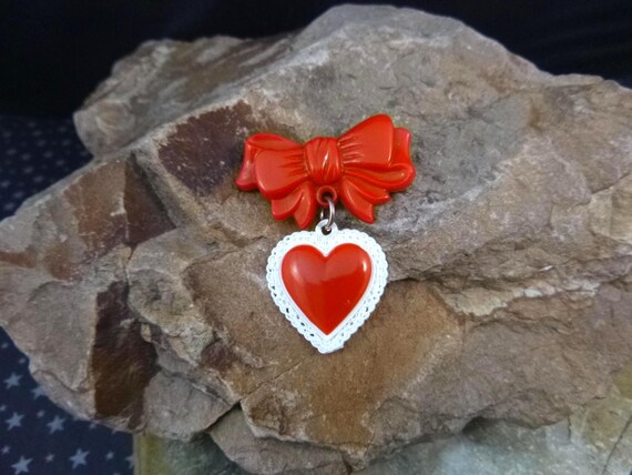1950s Celluloid Plastic Red Valentine Heart Dangling from Bow Vintage Pin | Book Piece
