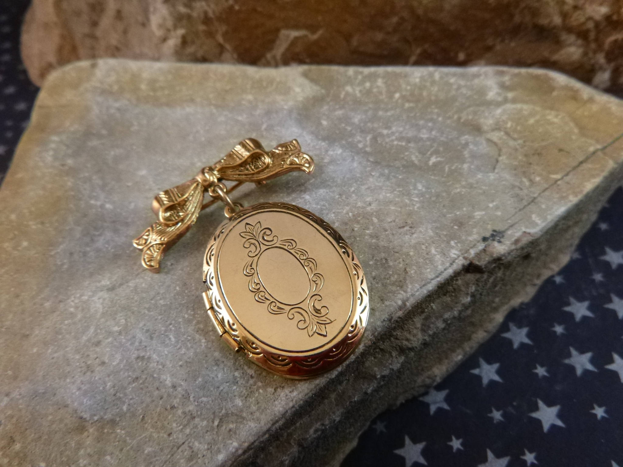 Victorian Revival Style Locket Brooch Dangling from Bow Locket Pin