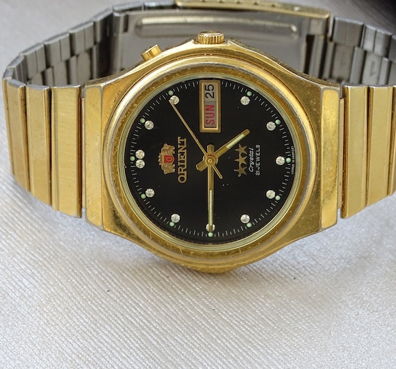 Reloj orient 3 estrellas dorado hotsell
