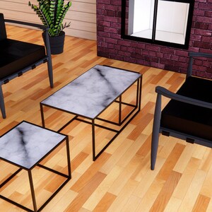 May include: A modern living room setup featuring two black armchairs and two marble-topped tables with black metal frames. The room has a brick fireplace and hardwood floors. Potted plants add a touch of greenery.