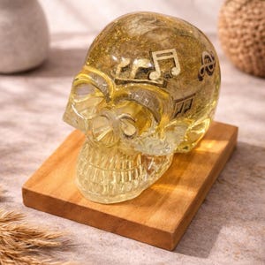 May include: A set of three ceramic mugs with a speckled, matte finish. The mugs are in shades of cream, light gray, and dark gray. Each mug has a simple, minimalist design and a rounded handle.