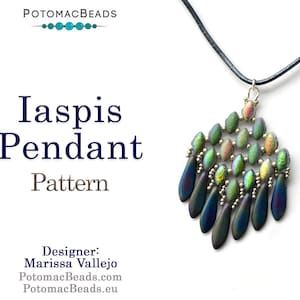 May include: A dark blue and green iridescent glass bead pendant with a black leather cord. The pendant is shaped like a teardrop and has a silver bead at the top. The pendant is labelled "Iaspis Pendant Pattern" and "Designer: Marissa Vallejo".