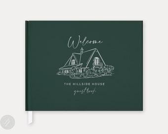 May include: A dark green guest book with a white illustration of a house and the text "Welcome" and "The Hillside House guest book".