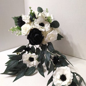 Elegant Black and white rose cascade bridal bouquet with anemone flowers and eucalyptus leaves