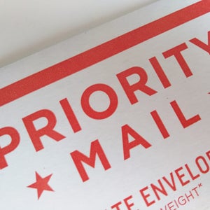 May include: Red and white Priority Mail envelope with a red star on each side. The text "PRIORITY MAIL" is in red.