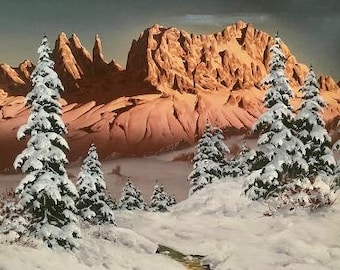 May include: A snowy mountain landscape with a large, rocky mountain range in the background. The foreground features several snow-covered evergreen trees.