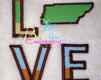May include: Embroidered design of the word "LOVE" with the letter "O" replaced by the outline of the state of Tennessee. The letters are brown with blue, tan, and light brown accents.