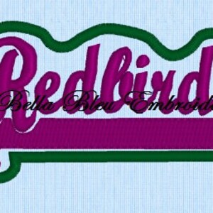 May include: Embroidered patch with the word "Redbirds" in a green outline and a purple background. The text "Bella Bleu Embroidery" is also visible.