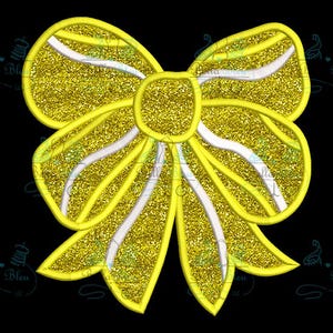 May include: A large, yellow, glittery bow with white stripes. The bow is made of fabric and has a shiny, sparkly finish.