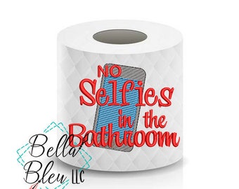 May include: White toilet paper roll with a red embroidered design that says "No Selfies in the Bathroom" with a blue and gray cell phone graphic.