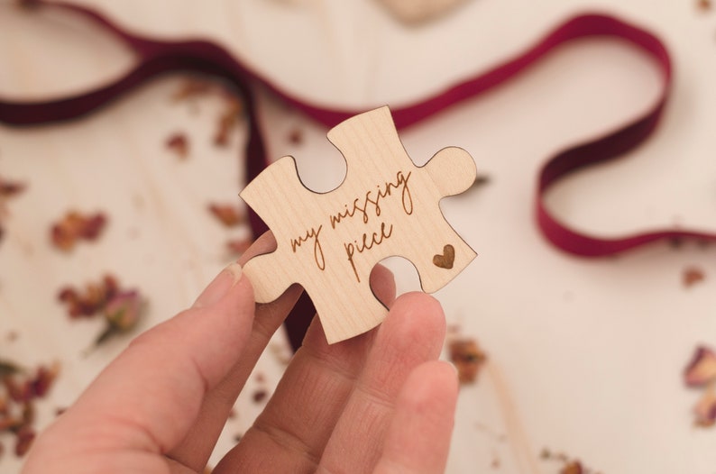 May include: A wooden puzzle piece with the text "my missing piece" and a small heart shape carved into it.
