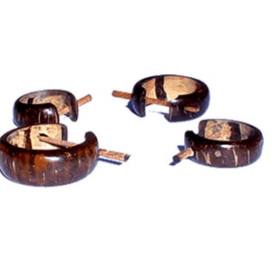 May include: Four pairs of brown coconut wood hoop earrings. The earrings are made from natural coconut wood and have a simple, elegant design.