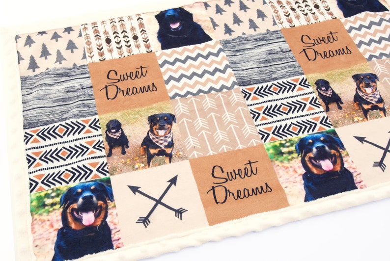 May include: A patchwork quilt with a variety of patterns, including arrows, geometric shapes, and wood grain. The quilt features multiple photos of Rottweilers and the text "Sweet Dreams".