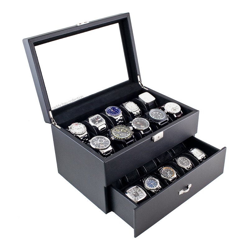 May include: Black leather watch box with a glass top and a pull-out drawer. The box is filled with 20 watches.