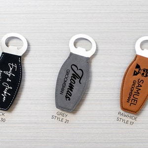 May include: Three bottle openers with stainless steel tops and leather handles. The handles are black, grey, and rawhide. The black opener has the text "Emily & Jackson April 1, 2028". The grey opener says "Thomas GROOMSMAN". The rawhide opener says "SAMUEL GROOMSMAN".