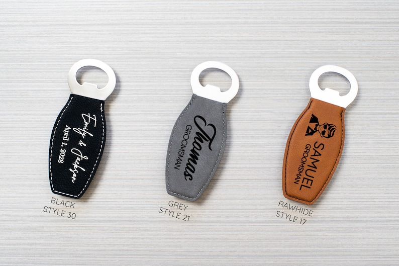 May include: Three bottle openers with stainless steel tops and leather handles. The handles are black, grey, and rawhide. The black opener has the text "Emily & Jackson April 1, 2028". The grey opener says "Thomas GROOMSMAN". The rawhide opener says "SAMUEL GROOMSMAN".