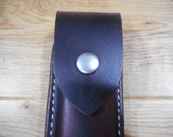 May include: A brown leather sheath with a white stitching detail and a silver snap closure.