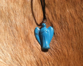 Carved stone angel necklace.  Made of turquoise.