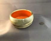 Pet Bowl with etched spiral line, variegated gray and beige tones, bright orange inside, holds 10 Fl ounces– Made by blind ceramic artist