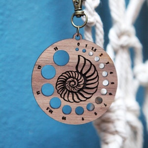 Knitting Needle Gauge Nautilus Shell - Walnut Wood with Bronze Clasp