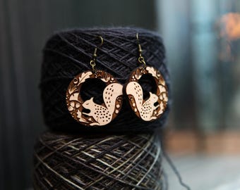 Squirrels with flowers and plant earrings made from maple wood ; great for those who love forest animals.