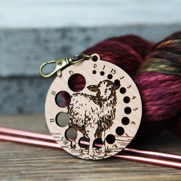 Knitting Needle Gauge Guide with a sheep standing on a grassy hill - Cherry wood with bronze clasp