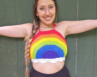 May include: A rainbow crochet halter top with a white crocheted trim. The top is made with a variety of colours, including red, orange, yellow, green, blue, indigo, and violet.