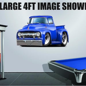 May include: A blue 1950s Ford pickup truck decal. The decal is 4 feet tall and is shown on a wall next to a pool table.
