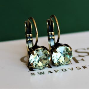 Antique Brass Plated Leverback Earrings made with Chrysolite Green Swarovski Crystal Elements. Earrings by Lady C