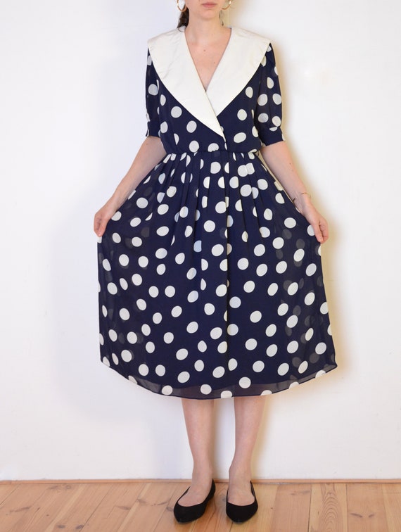 navy polka dot dress with white collar
