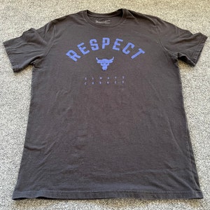 May include: Black t-shirt with a blue graphic of a bull's head and the text "RESPECT ALWAYS EARNED".