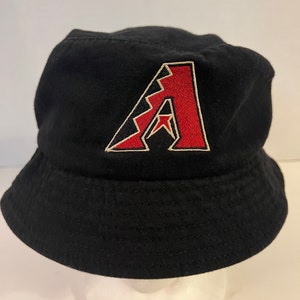May include: Black bucket hat with a red and white embroidered letter "A" on the front. The hat is made of a soft fabric and has a rounded crown and a short brim. The hat is a baseball fan accessory.
