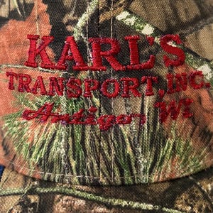 Antigo Wisconsin Hat NWT “Karl’s Transport” Mossy Oak Camo Flag image 2