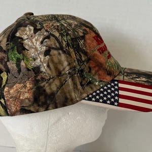 Antigo Wisconsin Hat NWT “Karl’s Transport” Mossy Oak Camo Flag image 5