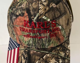 Antigo Wisconsin Hat NWT “Karl’s Transport” Mossy Oak Camo Flag