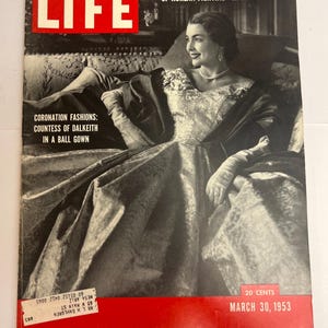 May include: A March 30, 1953, issue of LIFE magazine featuring a black and white cover photograph of the Countess of Dalkeith in a ball gown. The cover includes the text LIFE, A MARINE HERO'S OWN PHOTOS OF KOREAN FIGHTING—IN COLOR, and CORONATION FASHIONS.
