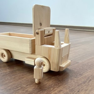 Hila, the wooden straight toy truck with a peg man driver low walls image 1