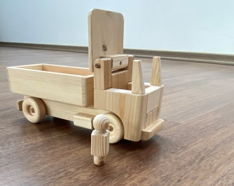 Hila, the wooden straight toy truck with a peg man driver - low walls