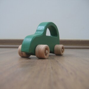 Green toy car made of wood image 2