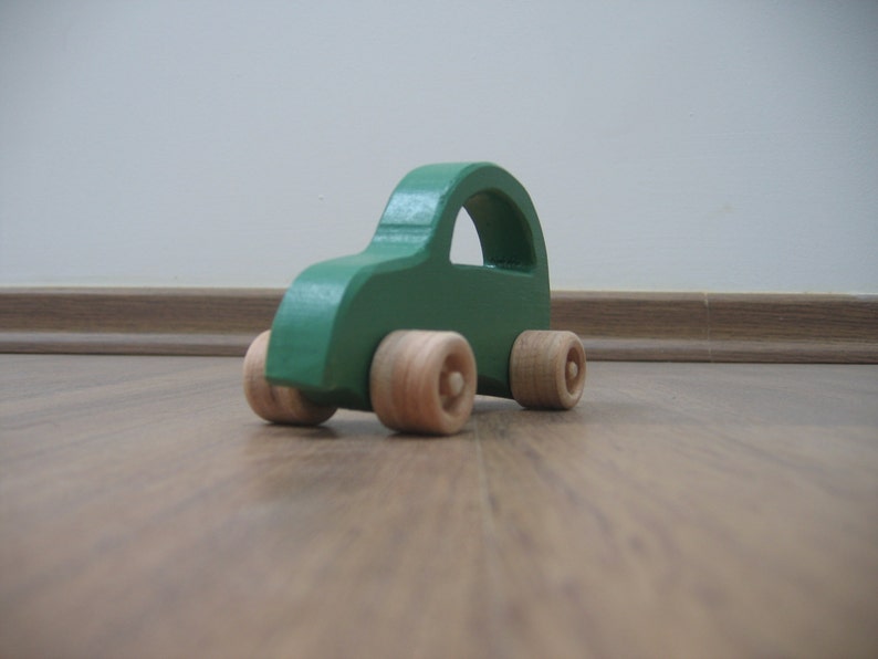 Green toy car made of wood image 2