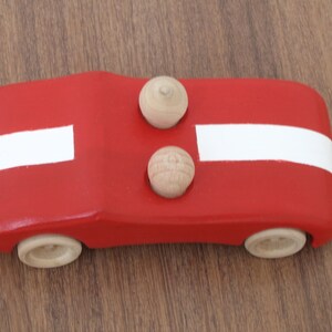 Handcrafted wooden toy red car with white stripe pretend play car toy with two peg people image 4