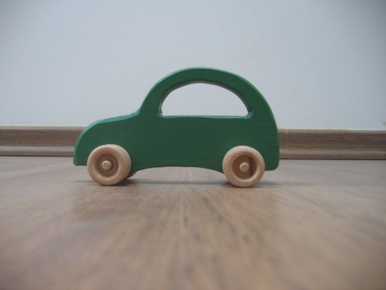 Green toy car made of wood image 1