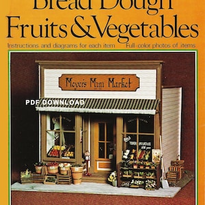 May include: A miniature model of a grocery store called "Meyers Mini Market" with a striped awning. The store has a window display of fruits and vegetables, including tomatoes, potatoes, and other produce. The model is made of wood and paper and is 1 inch to 1 foot scale.