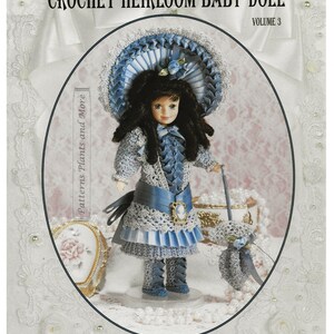 May include: Crochet heirloom baby doll pattern, volume 3, featuring a 1890 Victorian Bebe doll wearing a blue and white dress, bonnet, bloomers, boots, and parasol. The doll is holding a parasol and is standing on a white base.