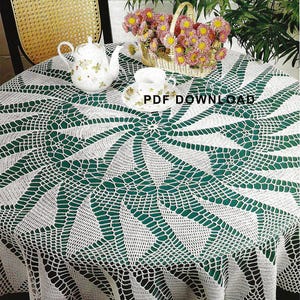 May include: White crocheted table cloth with a green background. The tablecloth has a circular design with a starburst pattern. The text "PDF DOWNLOAD" is visible in the image.