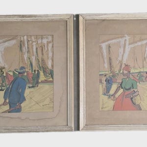 May include: Two framed abstract art prints. One depicts a man in a blue coat and hat, the other a woman in a green top and red skirt. Both have a beige background and are in light-colored wooden frames.
