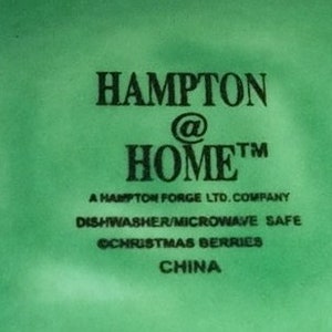 May include: Green and white logo for Hampton @ Home, a Hampton Forge LTD. company. The logo states that the product is dishwasher and microwave safe. The text "Christmas Berries" is also included. The logo indicates that the product is made in China.