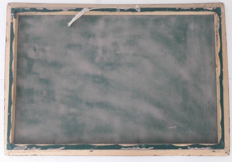 May include: A vintage wooden frame with a green chalkboard insert. The frame has a light brown finish and a slightly distressed look.