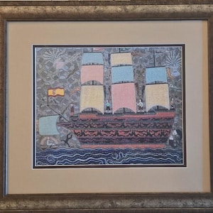 May include: Framed artwork of a sailing ship with sails in pink, yellow, and blue. The ship has a red hull and is set against a gray background with stylized waves. The artwork is framed in a brown, ornate frame. The artwork is in a brown, ornate frame.