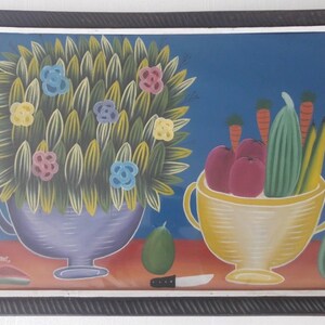 May include: A framed painting of a still life with a vase of flowers, a bowl of fruit, and vegetables. The flowers are yellow, pink, and blue. The fruit is red and the vegetables are green and yellow. The painting is on a blue background.